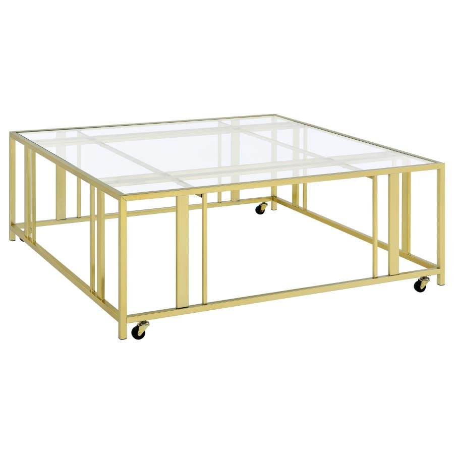 710188_02x900.jpg ADRI SQUARE GLASS TOP COFFEE TABLE WITH CASTERS MATTE BRASS - Image 1